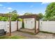 Backyard featuring a wooden pergola with vines and a fenced in yard at 3007 Colonel Springs Way, Fort Mill, SC 29708
