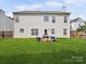 Spacious backyard features a large lawn and patio area, perfect for outdoor entertaining at 3014 Robin Terry Ct, Charlotte, NC 28208
