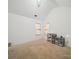 A bedroom with white walls, neutral carpet, and ample natural light from two windows at 3014 Robin Terry Ct, Charlotte, NC 28208