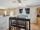 Casual dining area with table, chairs, and ceiling fan overlooking the kitchen at 3014 Robin Terry Ct, Charlotte, NC 28208