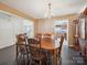 Dining room with wood table, chandelier, and views to the living room and kitchen at 3014 Robin Terry Ct, Charlotte, NC 28208