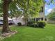 Charming two-story home featuring manicured lawn, vinyl siding, and traditional window shutters at 3014 Robin Terry Ct, Charlotte, NC 28208