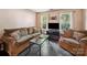 Comfortable living room with plush seating, dark wood floors, and plenty of natural light at 3014 Robin Terry Ct, Charlotte, NC 28208