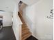 Carpeted staircase leading to the upper level of the home with white walls and railing at 3014 Robin Terry Ct, Charlotte, NC 28208