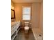 Bathroom with tile shower, marble vanity, and gray tile floor at 306 Sacco St, Belmont, NC 28012
