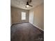 Bedroom with gray carpet, ceiling fan, and a closet at 306 Sacco St, Belmont, NC 28012