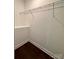 Walk-in closet with wire shelving and dark wood flooring at 306 Sacco St, Belmont, NC 28012