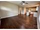 Open-concept living space with hardwood floors connecting the living room and the kitchen at 306 Sacco St, Belmont, NC 28012