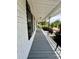 Inviting porch with classic railings offering relaxing outdoor space and curb appeal at 306 Sacco St, Belmont, NC 28012