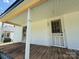 Inviting front porch featuring a vintage screen door, classic columns and natural wood accents at 324 S Spruce St, Rock Hill, SC 29730