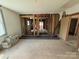Partially renovated living room featuring exposed beams and flooring, and awaiting personalized finishing touches at 324 S Spruce St, Rock Hill, SC 29730