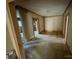 Neutral room featuring wood trim and doorways; an open area waiting for its personalized design and refurbishment at 324 S Spruce St, Rock Hill, SC 29730
