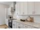 Modern kitchen featuring white cabinets, stainless steel appliances, and sleek countertops at 3409 Holabird Ln # 11, Charlotte, NC 28208