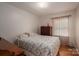 Cozy bedroom with hardwood floors, a full sized bed, and natural light at 3537 Heather Ln, Gastonia, NC 28056