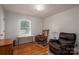 Bedroom featuring hardwood floors, a rocking chair, desk and a comfortable armchair at 3537 Heather Ln, Gastonia, NC 28056