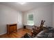 Bedroom with hardwood flooring, wooden cabinet and a cozy rocking chair at 3537 Heather Ln, Gastonia, NC 28056