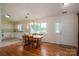 Dining room with wood floors, a wooden table and chairs, and lots of natural light at 3537 Heather Ln, Gastonia, NC 28056