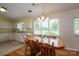 Bright dining area with ample natural light, adjacent to a kitchen, creating a warm atmosphere at 3537 Heather Ln, Gastonia, NC 28056