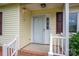 Close-up of a charming front porch with a classic white door, perfect for welcoming guests at 3537 Heather Ln, Gastonia, NC 28056