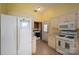 Functional kitchen with a refrigerator, stove, and microwave, perfect for everyday meal preparation at 3537 Heather Ln, Gastonia, NC 28056