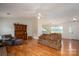 Open-concept living room featuring hardwood floors and lots of seating near the kitchen at 3537 Heather Ln, Gastonia, NC 28056