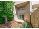 Townhome exterior featuring sliding glass doors to the backyard and neutral-toned siding at 3617 Willow Point Dr, Charlotte, NC 28277