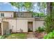 Inviting two-story townhome featuring neutral siding, a covered entryway, and mature trees enhancing curb appeal at 3617 Willow Point Dr, Charlotte, NC 28277