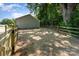 Spacious backyard featuring new wood fence, mature trees, and ample room for outdoor activities at 406 N Bostian St, China Grove, NC 28023