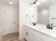 Bright bathroom featuring double vanity with quartz countertops and modern black fixtures at 406 N Bostian St, China Grove, NC 28023