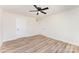 Cozy bedroom featuring modern vinyl flooring, a ceiling fan, and multiple closets for ample storage at 406 N Bostian St, China Grove, NC 28023