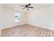 Well-lit bedroom with vinyl flooring, a ceiling fan, and a bright, neutral color scheme, ready for personalization at 406 N Bostian St, China Grove, NC 28023