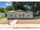 Charming single-story home with a covered front porch, landscaped yard, and inviting curb appeal at 406 N Bostian St, China Grove, NC 28023