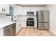 Stylish kitchen featuring stainless steel appliances, white cabinets, and modern fixtures providing a sleek design at 406 N Bostian St, China Grove, NC 28023