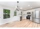 Modern kitchen with stainless steel appliances, sleek countertops, and ample cabinet space perfect for cooking at 406 N Bostian St, China Grove, NC 28023