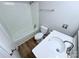 Bathroom displaying a tub, toilet, and vanity with a white countertop, showcasing a bright and clean space at 4209 Donnybrook Pl, Charlotte, NC 28205