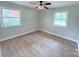Sun-lit corner bedroom with two windows and wood floors, offering a comfortable living space at 4209 Donnybrook Pl, Charlotte, NC 28205