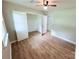 Cozy bedroom with hardwood floors, a ceiling fan, and a closet at 4209 Donnybrook Pl, Charlotte, NC 28205