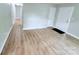 Spacious living room with light-colored floors, neutral walls, and ample natural light at 4209 Donnybrook Pl, Charlotte, NC 28205
