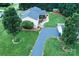 Drone shot of property including the house, trees, shed, driveway, and landscaped side yard at 4646 River Run Cir, Hickory, NC 28602