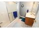 Bathroom featuring shower-tub combo, modern vanity, and bright lighting at 4646 River Run Cir, Hickory, NC 28602