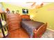 Cozy bedroom with hardwood floors, a ceiling fan, and a wooden bed with floral bedding at 4646 River Run Cir, Hickory, NC 28602