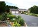 Traditional brick home with two-car garage, front porch and beautiful landscaping in front yard at 4646 River Run Cir, Hickory, NC 28602