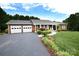 Lovely brick home with a lush lawn, inviting front porch, and convenient two-car garage at 4646 River Run Cir, Hickory, NC 28602