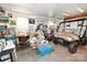 Garage interior view, revealing ample storage, workspace, and a brown ATV parked inside at 4646 River Run Cir, Hickory, NC 28602