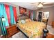 Comfortable main bedroom showcases bright accent colors, ceiling fan, and closet at 4646 River Run Cir, Hickory, NC 28602