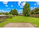 Beautiful backyard featuring lush green grass, a well-maintained fence, and mature trees at 4809 Mossy Cup Ln, Monroe, NC 28110