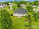 Areal view of the backyard with a patio and lawn surrounded by a wooden fence at 4809 Mossy Cup Ln, Monroe, NC 28110