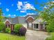 Well-maintained brick home with landscaped front yard, and a welcoming entrance at 4809 Mossy Cup Ln, Monroe, NC 28110