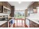 Modern kitchen with stainless steel appliances, white countertops, and eat-in breakfast nook at 4809 Mossy Cup Ln, Monroe, NC 28110