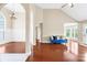 Open-concept living area with hardwood floors, modern archways and abundant natural light at 4809 Mossy Cup Ln, Monroe, NC 28110
